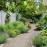 Spring garden refresh what to plant and tidy – featured image showing pruned shrubs, vegetable bed, compost, mulch, and clean path.