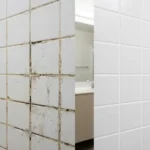 How to regrout bathroom tiles without a full renovation – featured image showing before and after comparison of cracked grout transformed to fresh white grout.
