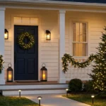 Christmas exterior lighting ideas that look elegant – featured image of a home with lit wreath, lanterns, garland, tree lights, and path lights.